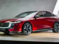 Elegancka, czerwona mazda elektryczna z nowoczesnym designem, prezentowana na drewnianej scenie.