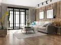 Soggiorno accogliente con divano beige, tavolino in legno e lampada gialla. Un esempio di come arredare casa con poco, creando stile e comfort.