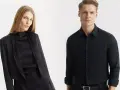 Elegancka kobieta w czarnej stylizacji i mężczyzna w czarnej koszuli. Jakie spodnie do czarnej koszuli? Klasyka zawsze w modzie.