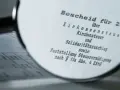 Bescheid über Einkommensteuer, Kirchensteuer und Solidaritätszuschlag. Möglicherweise muss man Kirchensteuer nachzahlen.
