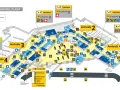 Plan lotniska w Amsterdamie Schiphol Plaza z oznaczeniami przylotów, odlotów i udogodnień.