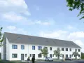 Nowoczesny dom szeregowy z białymi ścianami i szarym dachem, otoczony zielenią.