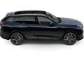 Eleganckie, nowe BMW X5 w ciemnogranatowym kolorze, z panoramicznym dachem i stylowymi felgami, gotowe na każdą podróż.