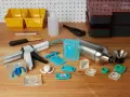 Tools for using resin in silicone molds are laid out, including a caulking gun, various silicone molds, and mixing containers.