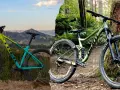 A yellow and teal hardtail bike stands against a mountain backdrop, contrasted with a green full suspension bike in a lush forest.