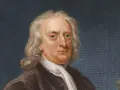 Portrait d'Isaac Newton, le génie qui a découvert la gravité. Il porte une perruque et une tenue d'époque.