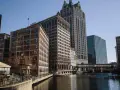 A scenic view of Milwaukee's riverfront buildings, perfect for a weekend getaway.