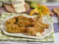 Fiori di zucca ripieni al forno, dorati e croccanti, con un cuore filante di mozzarella.