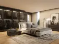 Camera da letto moderna con comò scuro, specchio dorato e un armadio a vista. Ideale per ispirazione su cosa mettere sul comò della camera da letto moderna.
