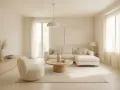 Salon w odcieniach beżu. Miękka sofa, okrągły stolik i puszysty fotel tworzą przytulną przestrzeń. Jak wygląda kolor beżowy? Jak na dłoni!