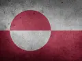 Tekstura flagi Grenlandii. Czerwony okrąg na białym tle, podzielony na dwie części, symbolizuje słońce i lodowiec.
