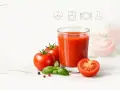 Szklanka soku pomidorowego, pomidory i bazylia. Czy sok pomidorowy jest zdrowy? Ikony symbolizujące zdrowie i dietę.