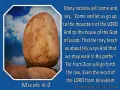 A large, weathered boulder rests precariously on smaller rocks under a blue, cloudy sky, illustrating a verse from Micah in the Bible.