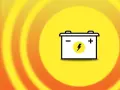 A car battery icon on a yellow background with orange rings. Does disconnecting battery clear codes?