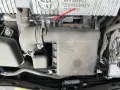A red arrow points to a clip on the air intake system of a Toyota Hybrid Synergy Drive. This could be related to a p0102 code.