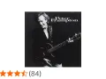 Peter Frampton, lächelnd mit Gitarre, auf dem Cover seines Albums.