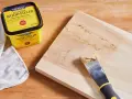 Learn how to use wood filler to repair cracks and gouges on wood. A Minwax container and putty knife are shown.