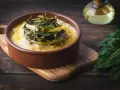 Polenta cremosa con cicoria in padella, un piatto rustico e saporito.