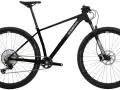 Sleek black mountain bike with "Superior." branding, ready for any road or trail. Features RockShox fork and Schwalbe tires.