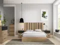 Habitación moderna con cama de madera, mesitas de noche, cómoda y alfombra de diseño. Varios tipos de alfombras se ven en la imagen, aportando calidez.