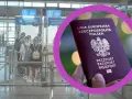 Paszport UE w dłoni, a w tle kolejka do kontroli granicznej. Czy do Wielkiej Brytanii trzeba mieć paszport? Sprawdź zasady wjazdu.