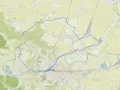 Mapa z zaznaczoną pętlą tras rowerowych w Polsce, prowadzącą przez tereny zielone i okolice Przemyśla.