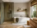 Salle de bain moderne avec douche vitrée, baignoire spacieuse pour un bain relaxant de plusieurs litres, et lavabo en pierre naturelle.