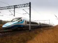 Nowoczesny Pendolino pędzi po torach, symbolizując rosnącą prędkość pociągów w Polsce.