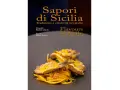 Un piatto di spaghetti con pesce fritto e scorza d'arancia, che celebra i sapori tipici siciliani.
