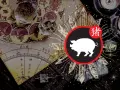 Chiński znak zodiaku: pies chiński. Obok symbolu psa chińskiego widnieje znak zodiaku.