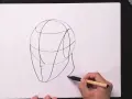 Un boceto de cabeza con líneas guía, parte de una lección de retratos fáciles.