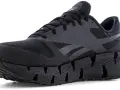 Zapatilla deportiva negra Reebok con suela dentada. La talla Reebok es perfecta para correr.