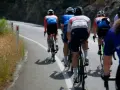 Cyclists in racing gear tackle a steep road, their shadows stretching long on the asphalt. This is the essence of category climbs cycling.