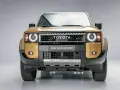 Nowy Land Cruiser Prado w złotym kolorze, z charakterystycznym grillem i okrągłymi światłami.