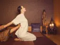 A woman receives a traditional Thai massage, a practice with a rich history rooted in ancient healing traditions.