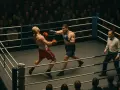 Dos boxeadores en un ring, uno golpea al otro. El árbitro observa. Una escena intensa, como en los mejores juegos de boxeo pc.