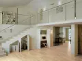 Sottoscala trasformato in un funzionale ripostiglio sottotetto, con vani contenitori e una piccola postazione studio.