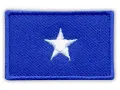 Naszywka z niebieskim tłem i białym, pięcioramiennym gwiazdorem. Symbolizuje flagę Somalii.