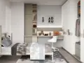 Moderna zona studio ragazzi con letto, scrivania, libreria e armadio.