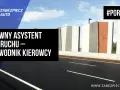 Aktywny asystent pasa ruchu – przewodnik kierowcy. Droga z nowoczesnymi barierami i chmurami na niebie. #PORADNIK