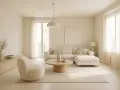 Jasny salon w odcieniach beżowego koloru. Duża, narożna sofa, okrągły stolik kawowy i wygodny fotel tworzą przytulną przestrzeń.