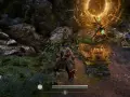 Un guerrero se acerca a un santuario de Nioh, rodeado de vegetación y rocas. Una luz dorada emana del santuario.