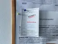 Zawiadomienie z Poczty Polskiej o przesyłce poleconej, która czeka na odbiór.