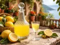 Słoneczny taras, koszyk cytryn i karafka z domowym limoncello. Idealny przepis na włoski likier.
