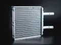A new heater core, essential for a heater core replacement, sits ready for installation. Its fins are clean and ready to warm your car.