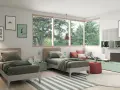 Cameretta con 2 letti singoli, decorazioni a tema videogiochi e un'ampia finestra con vista sul verde.