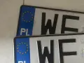 Dwie polskie tablice rejestracyjne z literami "WF" i unijnym symbolem.