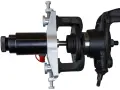 Automotive hub bearing removal and installation tool with a black hydraulic cylinder and silver clamp.