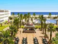 Luksusowy hotel Marco Polo w Tunezji, z basenem, palmami i widokiem na morze. Idealne miejsce na wakacje.