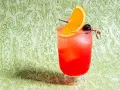 Orzeźwiający drink z Cointreau, pomarańczą i wiśnią. Idealny na letnie wieczory.
